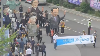 대형 종이탈로 만든 '희생자들 얼굴'…금남로를 걷다