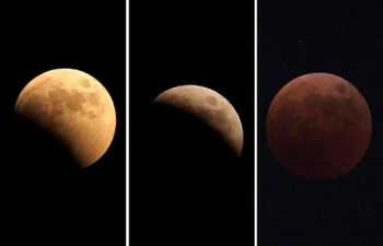 [사진] 오늘밤 천문쇼 보셨나요…지구 그림자 뒤로 쏙, 붉게 물든 달
