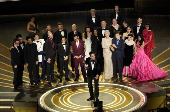 The cast and crew of ″Everything Everywhere All at Once″ accepts the award for best picture at the Oscars on Sunday, March 12, 2023, at the Dolby Theatre in Los Angeles. (AP Photo/Chris Pizzello)