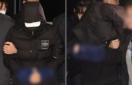 19일 오후 경복궁 담장을 스프레이로 낙서해 훼손하고 도주한 피의자 2명이 서울 종로경찰서로 들어서고 있다. 〈사진=연합뉴스〉