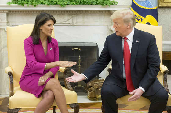 epa07081195 US President Donald J. Trump (R) and US Ambassador to the United Nations Nikki Haley shake hands in the Oval Office of the White House in Washington, DC, USA, 09 October 2018. Trump and Haley announced that Haley will leave her position at the end of the year. EPA/MICHAEL REYNOLDS