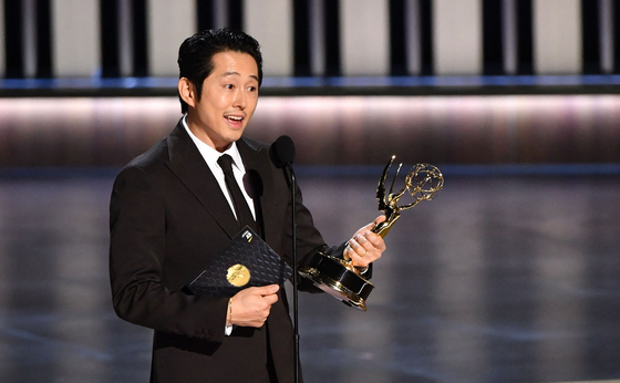 US actor Steven Yeun accepts the award for Outstanding Lead Actor in a Limited or Anthology Series or Movie for "Beef" onstage during the 75th Emmy Awards at the Peacock Theatre at L.A. Live in Los Angeles on January 15, 2024. (Photo by Valerie Macon / AFP)  〈저작권자(c) 연합뉴스, 무단 전재-재배포, AI 학습 및 활용 금지〉