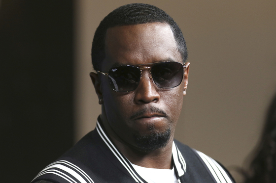 FILE - In this May 30, 2018, file photo, Sean "Diddy" Combs arrives at the LA Premiere of "The Four: Battle For Stardom" at the CBS Radford Studio Center in Los Angeles. Combs' lawyer said Tuesday, March 26, 2024, that the searches of his Los Angeles and Miami properties by federal authorities in a sex-trafficking investigation were ”a gross use of military-level force" and that Combs is “innocent and will continue to fight" to clear his name. (Photo by Willy Sanjuan/Invision/AP, File) MAY 30, 2018, FILE PHOTO; 053018123545, 21334631,  〈저작권자(c) 연합뉴스, 무단 전재-재배포, AI 학습 및 활용 금지〉